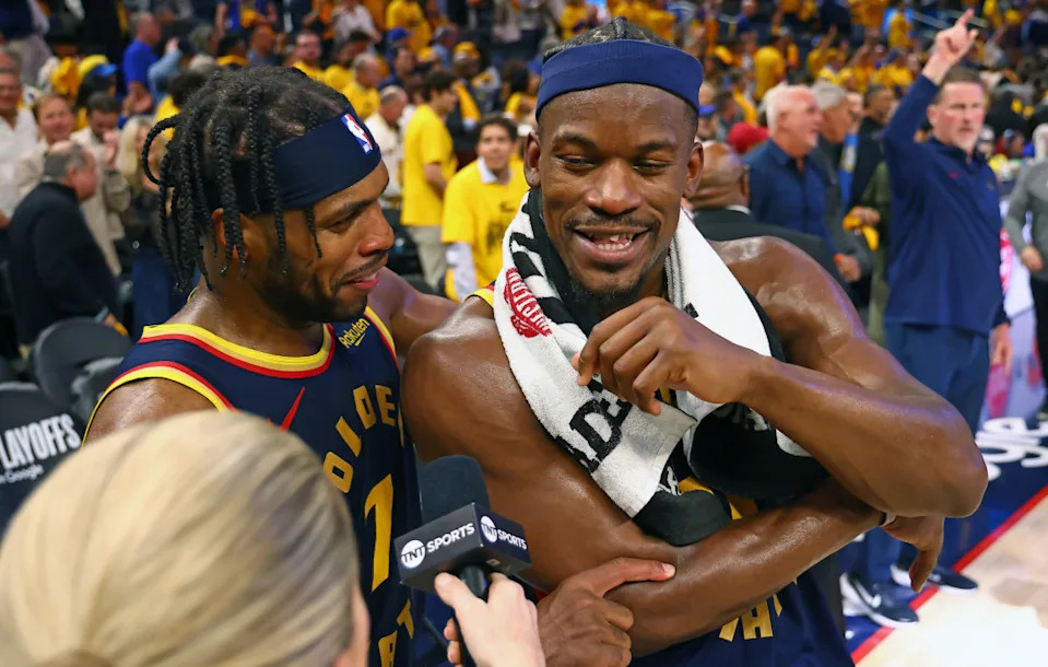 Golden State Warriors guard Buddy Hield, left, celebrates with forward Jimmy Butler as he speaks to TNT beating the Houston Rockets.Kelley L Cox-Imagn Images