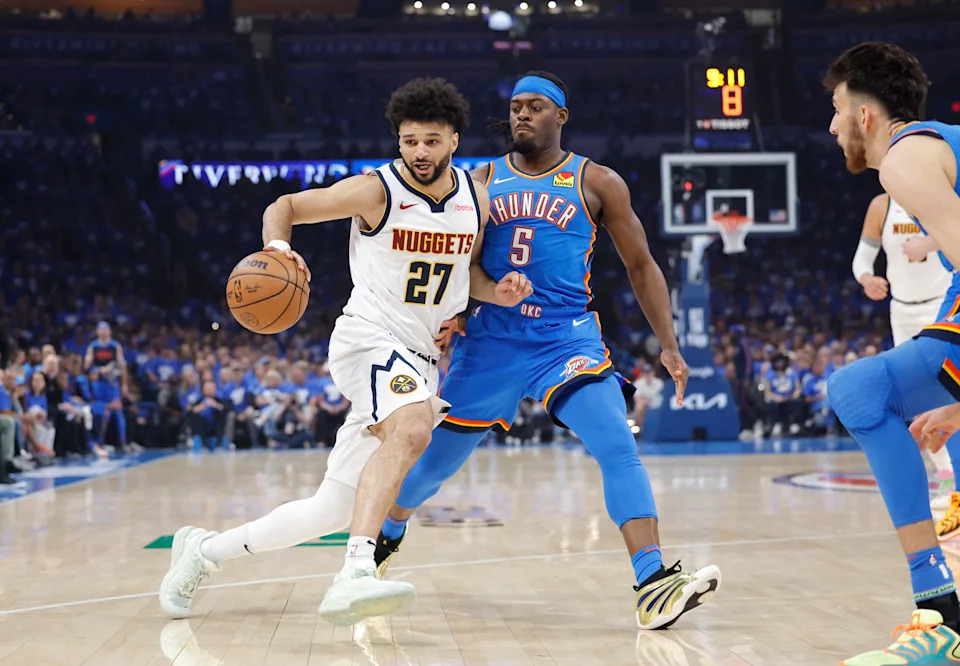 Denver Nuggets guard Jamal Murray (27) moves the ball down the court beside Oklahoma City Thunder guard Luguentz Dort (5) in the first quarter during game seven of the second round for the 2025 NBA Playoffs at Paycom Center in Oklahoma City on May 18, 2025.