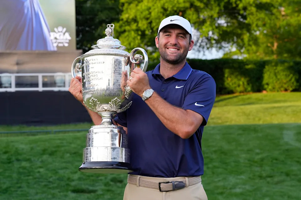 Charlotte, North Carolina, USA; Scottie Scheffler poses for a photo with the Wanamaker Trophy after winning the PGA Championship golf tournament at Quail Hollow.Jim Dedmon-Imagn Images