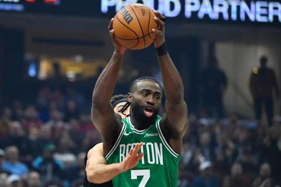 Feb 4, 2025; Cleveland, Ohio, USA; Boston Celtics guard Jaylen Brown (7) rebounds in the first quarter against the Cleveland Cavaliers at Rocket Mortgage FieldHouse. Mandatory Credit: David Richard-Imagn Images