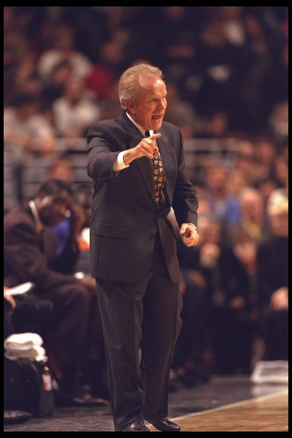 28 Jan 1996: Head coach Cotton Fitzsimmons of the Phoenix Suns directs the action on the court from the sideline at the United Center in Chicago, Illinois, during the game against the Chicago Bulls. The Bulls defeated the Suns 93-82. Mandatory Credit:
