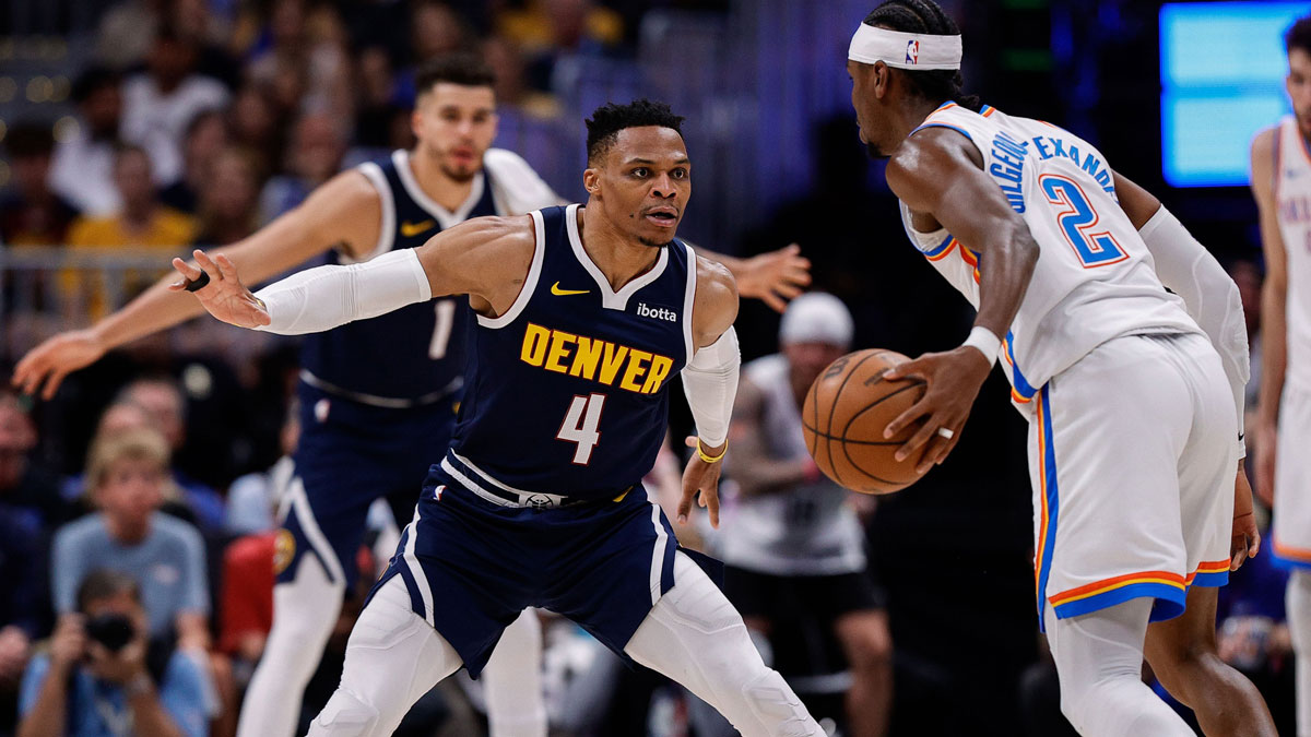 Oklahoma City Thunder guard Shai Gilgeous-Alexander (2) controls the ball as Denver Nuggets guard Russell Westbrook (4) guards in the third quarter during game four of the second round of the 2025 NBA Playoffs at Ball Arena. 