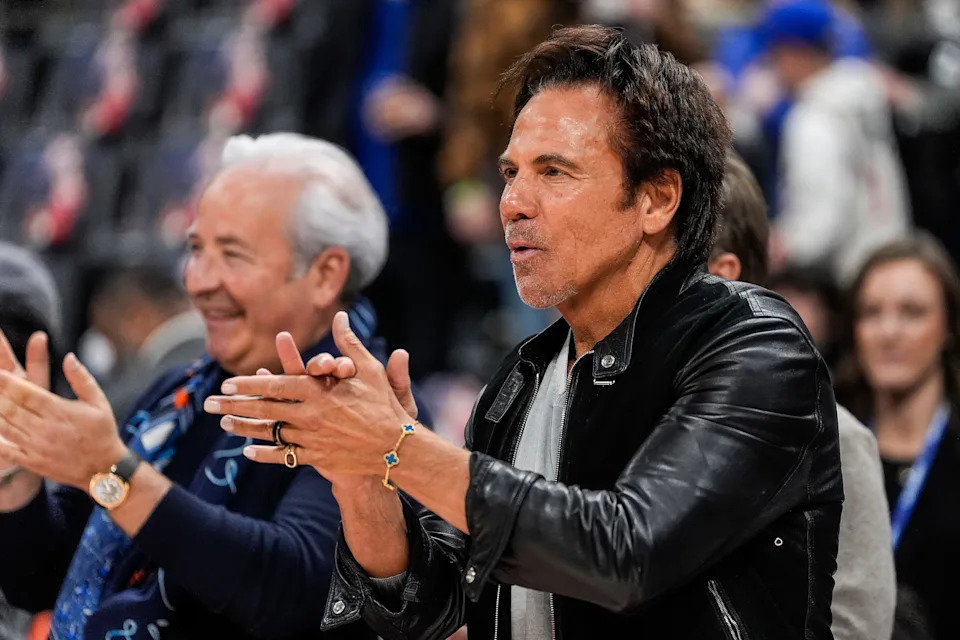 Detroit Pistons owner Tom Gores applauds after forward Tobias Harris’ speech ahead of tip-off against Milwaukee Bucks during the first half at Little Caesars Arena in Detroit on Friday, April 11, 2025.