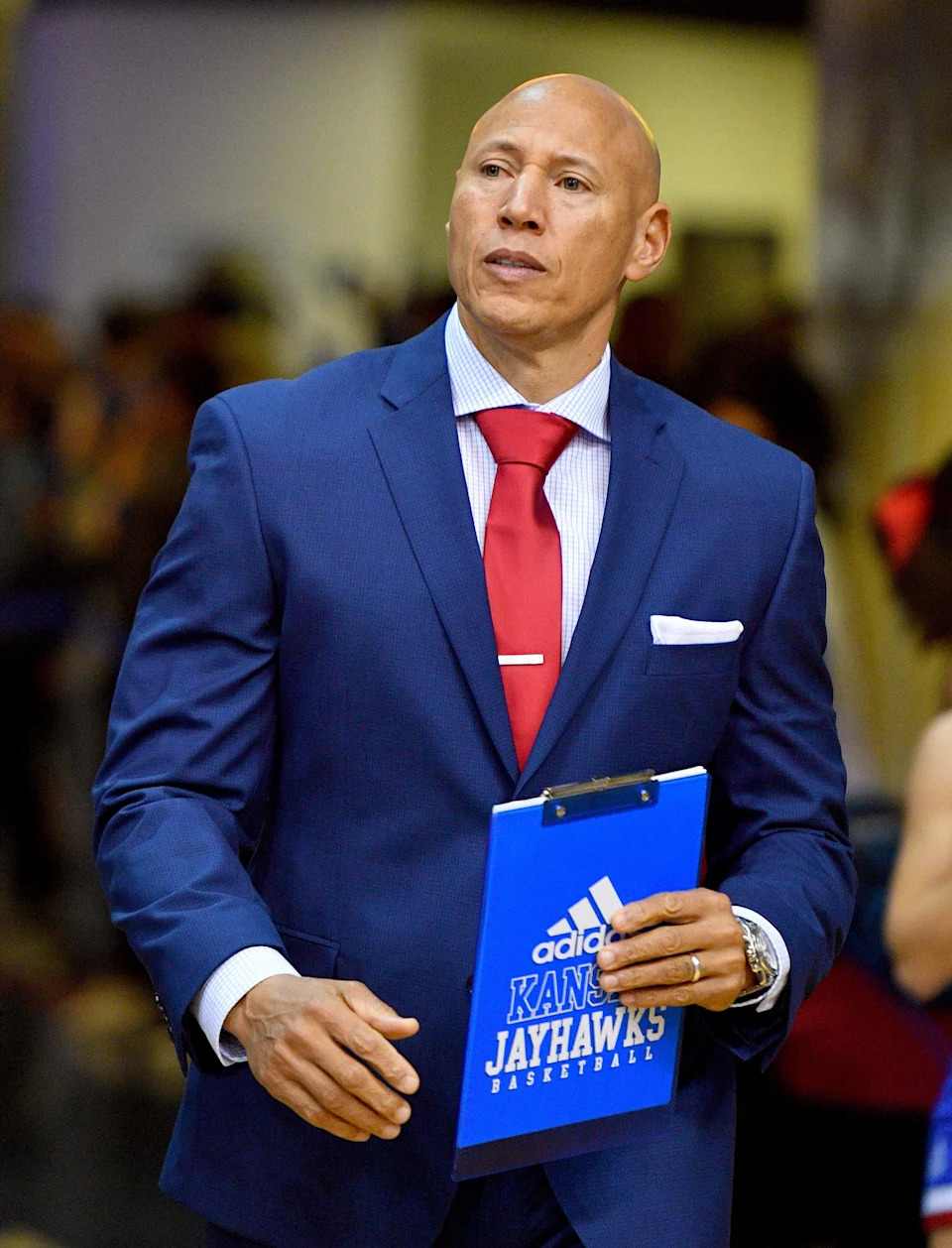 Jan 4, 2020; Lawrence, Kansas, USA; Kansas Jayhawks director of operations Fred Quartlebaum enters the court before the game against the West Virginia Mountaineers at Allen Fieldhouse.