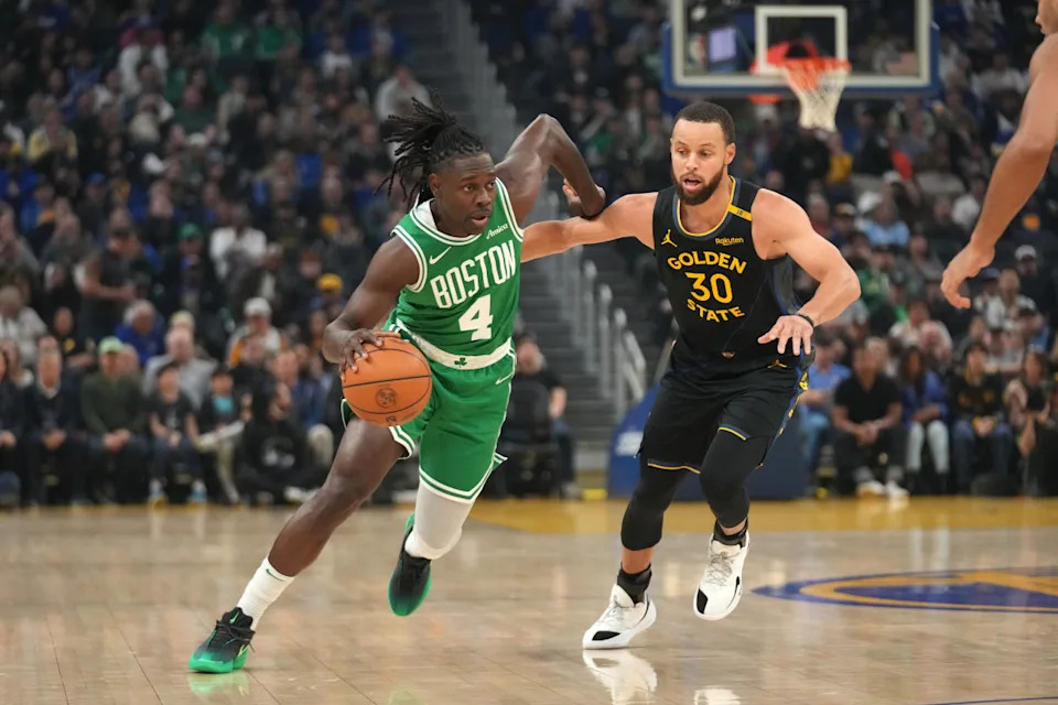 Jan 20, 2025; San Francisco, California, USA; Boston Celtics guard Jrue Holiday (4) dribbles past Golden State Warriors guard Stephen Curry (30) in the first quarter at the Chase Center. © Cary Edmondson-Imagn Images