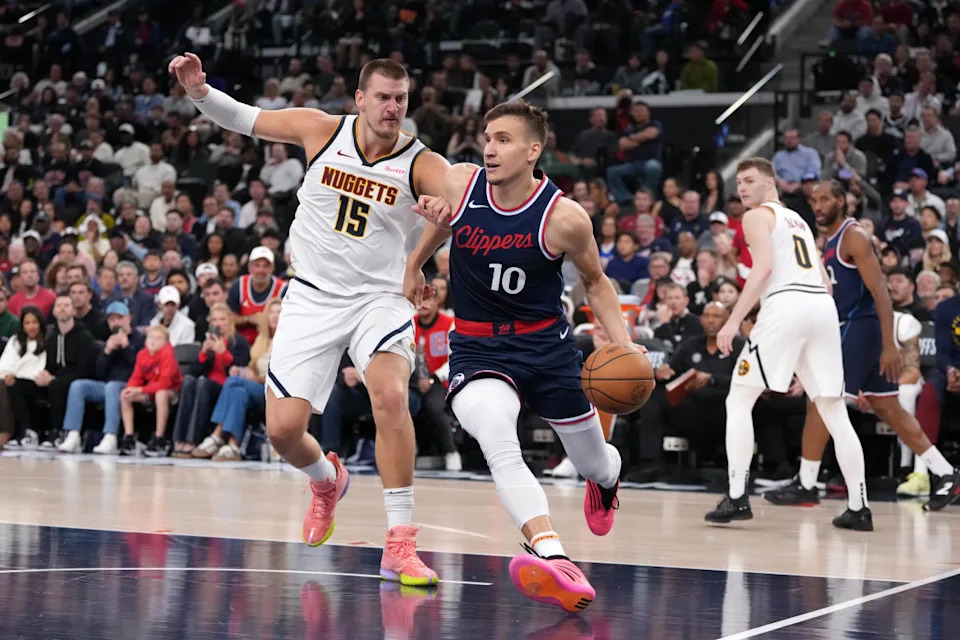 Bogdan Bogdanovic (10) drives past Nikola Jokic (15) in the 2025 NBA Playoffs. Mandatory Credit: Kirby Lee-Imagn Images