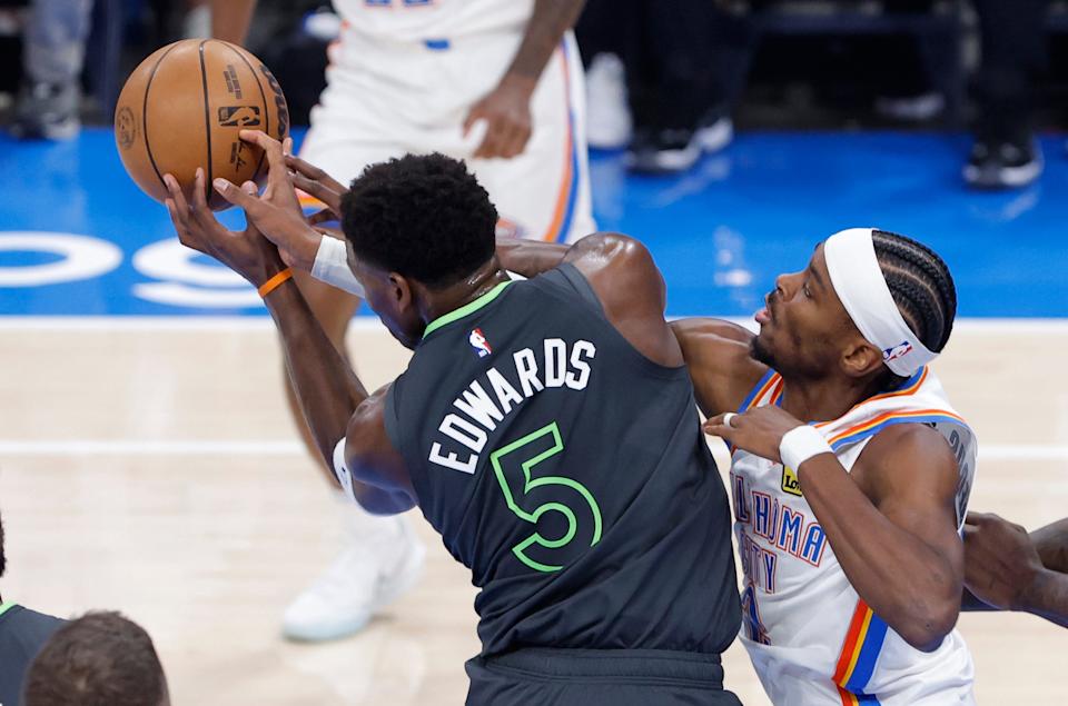 Anthony Edwards and Shai Gilgeous-Alexander fight for a rebound in the first quarter during Game 1 of the Western Conference finals.