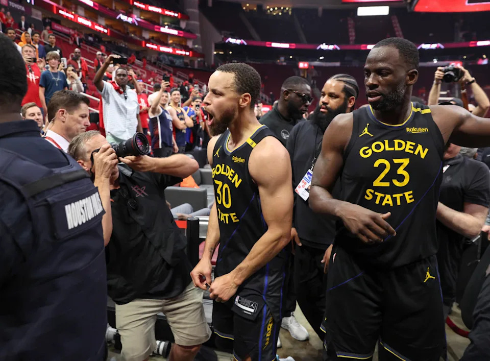 Golden State Warriors guard Stephen Curry (30) and forward Draymond Green (23) walk off the court after game seven of the first round for the 2025 NBA Playoffs against the Houston Rockets at Toyota Center. Mandatory Credit: Troy Taormina-Imagn Images