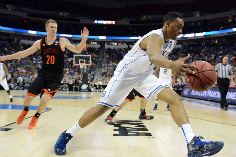 Duke Blue Devils forward Jabari Parker saves a ball from going out of bounds.