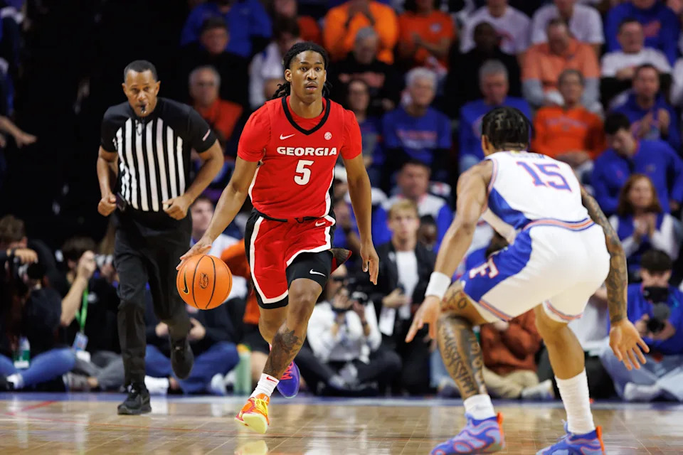 Jan 25, 2025; Gainesville, Florida, USA; Georgia Bulldogs guard Silas Demary Jr. (5) dribbles the ball at Florida Gators guard Alijah Martin (15) during the first half at Exactech Arena at the Stephen C. O'Connell Center. Mandatory Credit: Matt Pendleton-Imagn Images
