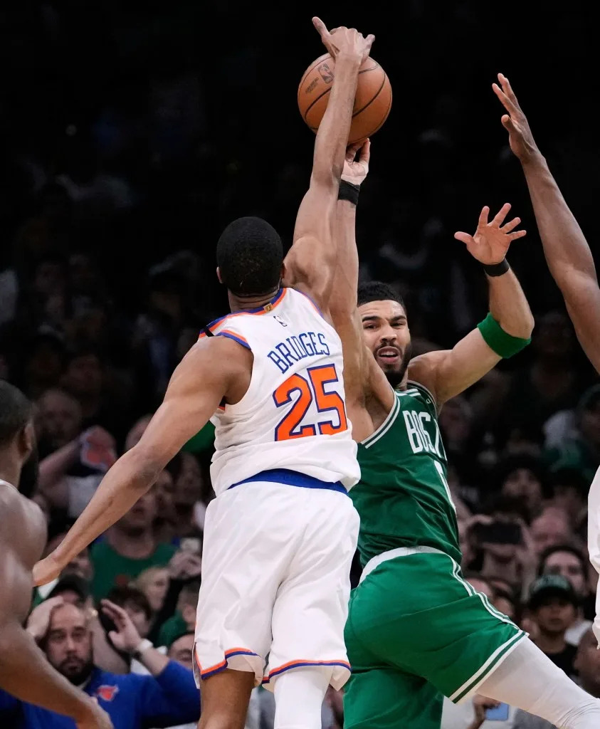 Mikal Bridges (25) reaches up and makes the game-winning steal against Boston Celtics forward Jayson Tatum (0) in the final seconds of the second half of Game 2. AP