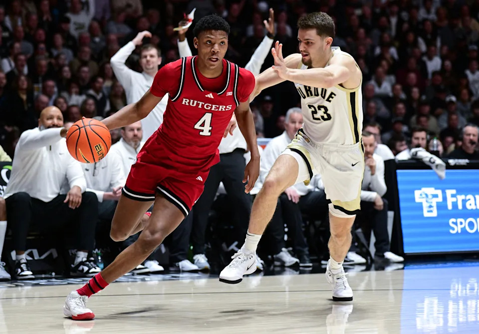 Mar 4, 2025; West Lafayette, Indiana, USA; Rutgers Scarlet Knights guard Ace Bailey (4) drives the ball around Purdue Boilermakers forward Camden Heide (23) during the first half at Mackey Arena. Mandatory Credit: Marc Lebryk-Imagn Images
