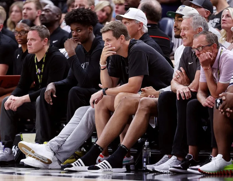 Jazz coach Will Hardy watches with team officials and coaches as the Utah Jazz and Philadelphia 76ers play in Summer League.