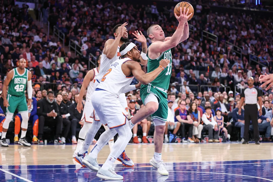 Payton Pritchard of the Celtics goes up with the ball against Miles McBride and Karl Anthony-Towns of the Knicks on Saturday, May 10, 2025. © Wendell Cruz-Imagn Images