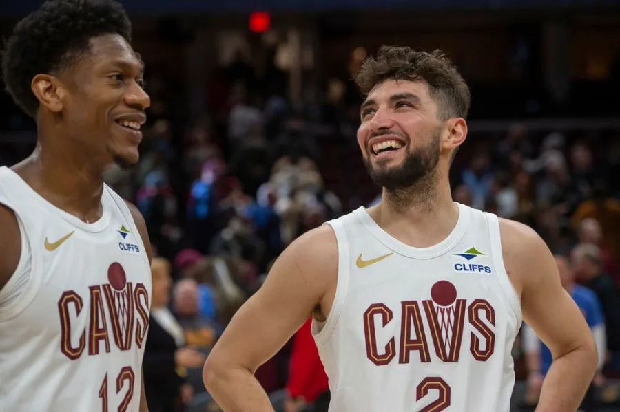 Cleveland Cavaliers’ De’Andre Hunter and Ty Jerome are all smiles after an NBA basketball game against the Portland Trail Blazers in Cleveland, Sunday, March 2, 2025. (AP Photo/Phil Long)