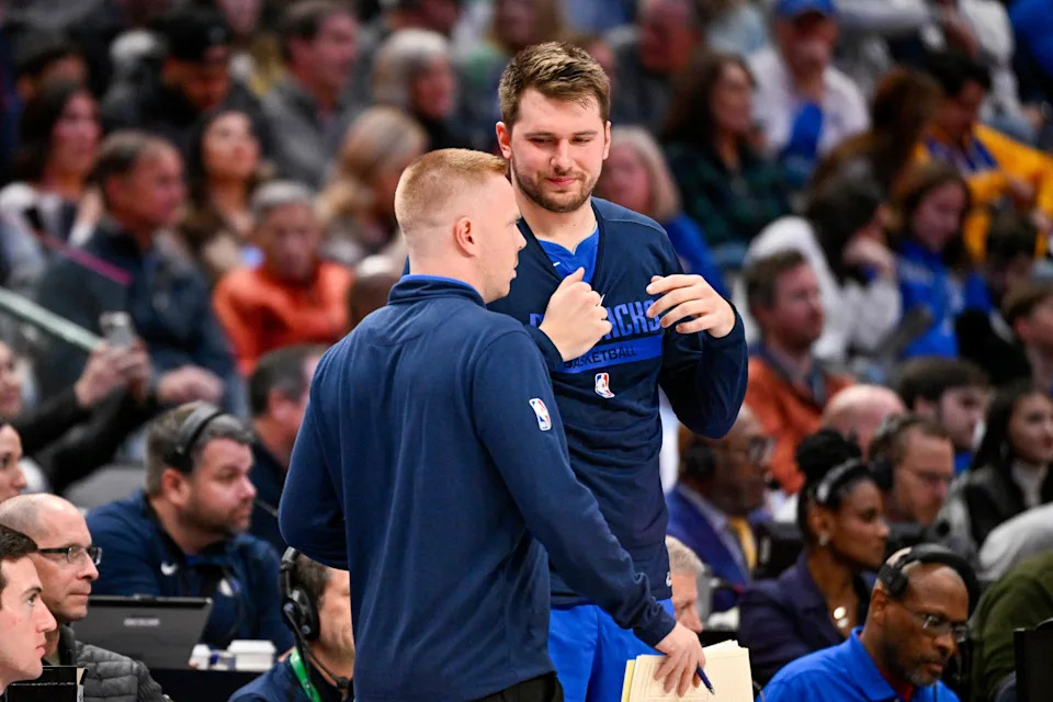 Dallas Mavericks assistant coach Sean Sweeney and guard Luka Doncic speak during the game vs. the Denver Nuggets at the American Airlines Center, Nov. 18, 2022 in Dallas.