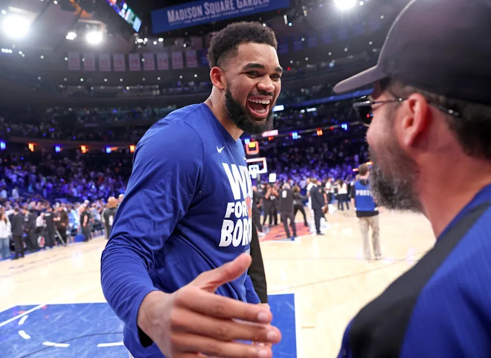 Karl-Anthony Towns #32 of the New York Knicks celebrates with Ronnie Fieg at the end of the fourth quarter. The New York Knicks defeat the Boston Celtics 119-81 to move onto the Eastern Conference Finals. Charles Wenzelberg/New York Post