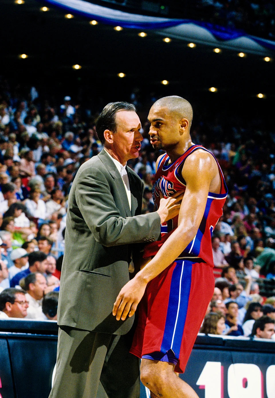 Apr 26, 1996; Orlando, FL; USA; FILE PHOTO; Detroit Pistons head coach Doug Collins talks with forward Grant Hill (33) on the sidelines against the Orlando Magic during the first round of the 1996 NBA Playoffs at the Orlando Arena.