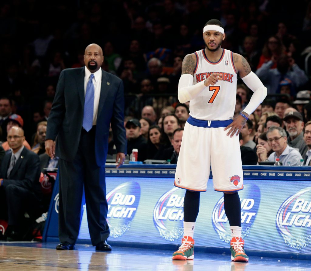 New York Knicks forward Carmelo Anthony (R) calls out a play to his team in front of New York Knicks head coach Mike Woodson in the second half of their NBA game against the Washington Wizards at Madison Square Garden in New York, New York, USA, 04 April 2014.