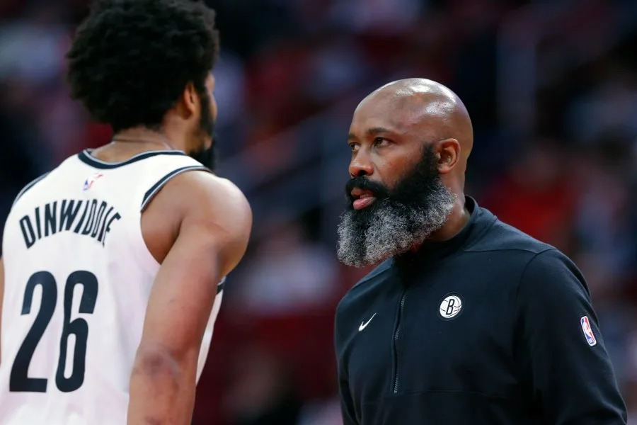 Brooklyn Nets head coach Jacque Vaughn, right, talks with guard Spencer Dinwiddie (26) during the first half of an NBA basketball game against the Houston Rockets Wednesday, Jan. 3, 2024, in Houston. (AP Photo/Michael Wyke)