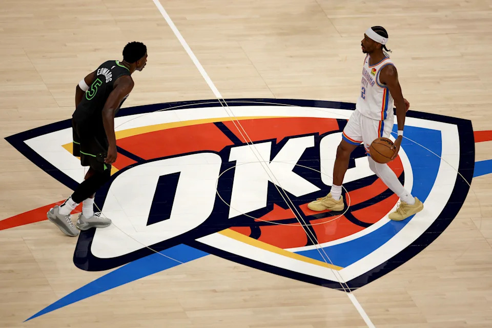 OKLAHOMA CITY, OKLAHOMA - MAY 20: Shai Gilgeous-Alexander #2 of the Oklahoma City Thunder dribbles the ball against Anthony Edwards #5 of the Minnesota Timberwolves during the second half in Game One of the Western Conference Finals of the 2025 NBA Playoffs at Paycom Center on May 20, 2025 in Oklahoma City, Oklahoma. NOTE TO USER: User expressly acknowledges and agrees that, by downloading and or using this photograph, User is consenting to the terms and conditions of the Getty Images License Agreement. (Photo by William Purnell/Getty Images)