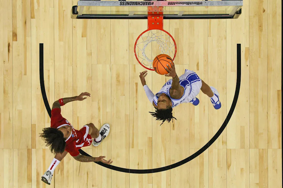 Mar 29, 2025; Newark, NJ, USA; Duke Blue Devils guard Isaiah Evans (3) dunks the ball in front of Alabama Crimson Tide guard Labaron Philon (0) during the East Regional final of the 2025 NCAA tournament at Prudential Center. Mandatory Credit: Vincent Carchietta-Imagn Images Vincent Carchietta-Imagn Images