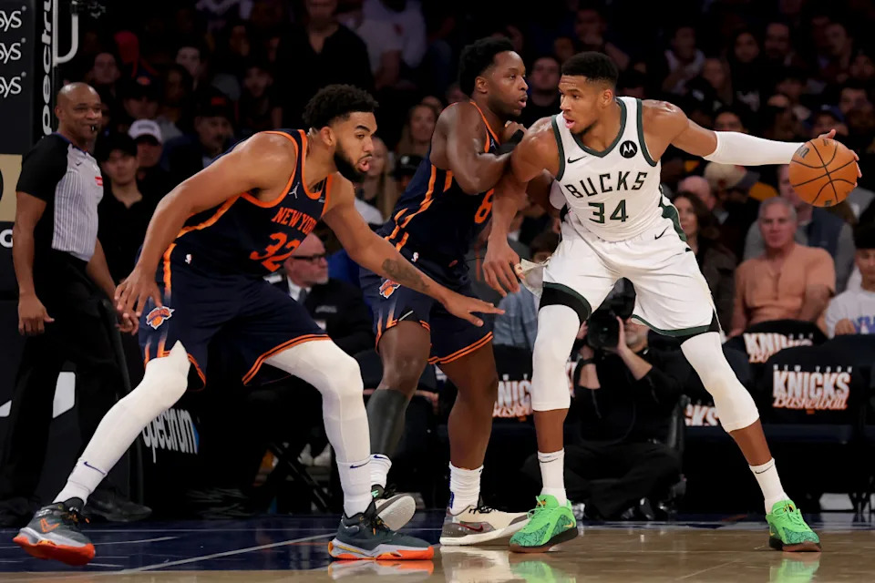Milwaukee Bucks forward Giannis Antetokounmpo controls the ball against New York Knicks forward OG Anunoby and center Karl-Anthony Towns during the third quarter at Madison Square Garden.Brad Penner-Imagn Images