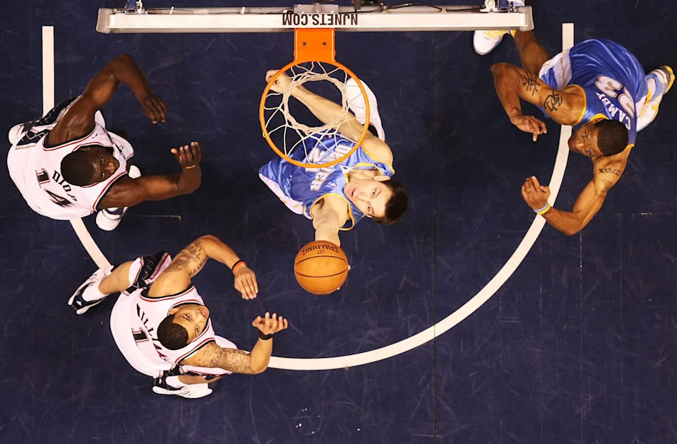 EAST RUTHERFORD, NJ - MARCH 21: Linas Kleiza #43 of the Denver Nuggets rebounds the ball as teammate Marcus Camby looks on with Marcus Williams #1 and Diop DeSagana #14 of the New Jersey Nets during their game on March 21, 2008 at the Izod Arena in East Rutherford, New Jersey. Photo By Al Bello/Getty Images. NOTE TO USER: User expressly acknowledges and agrees that, by downloading and/or using this Photograph, user is consenting to the terms and conditions of the Getty Images License Agreement. (Photo by Al Bello/Getty Images)