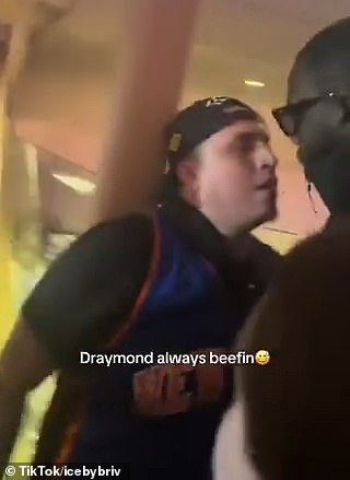 The Knicks fan is confronted by a man after loudly criticizing Draymond Green at MSG