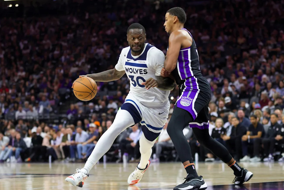 Oct 24, 2024; Sacramento, California, USA; Minnesota Timberwolves forward Julius Randle (30) controls the ball against Sacramento Kings forward Keegan Murray (13) during the third quarter at Golden 1 Center. Sergio Estrada-Imagn Images