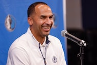 Dallas Mavericks general manager Nico Harrison laughs during a news conference after the...