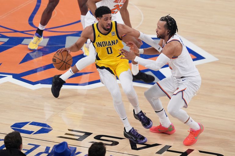 Indiana Pacers guard Tyrese Haliburton (0) drives against New York Knicks guard Jalen Brunson (11) during the first quarter of Game 5 of the NBA basketball Eastern Conference final