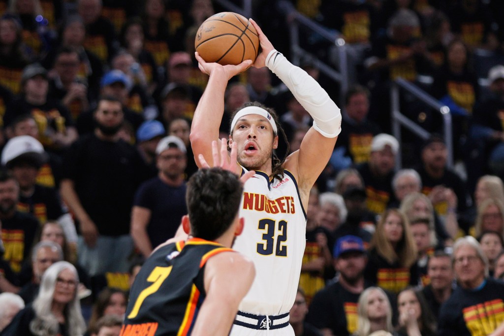 Denver Nuggets forward Aaron Gordon (32) shoots as Oklahoma City Thunder's Chet Holmgren (7) defends in the first half of Game 1 of an NBA basketball second-round playoff series Monday, May 5, 2025, in Oklahoma City.