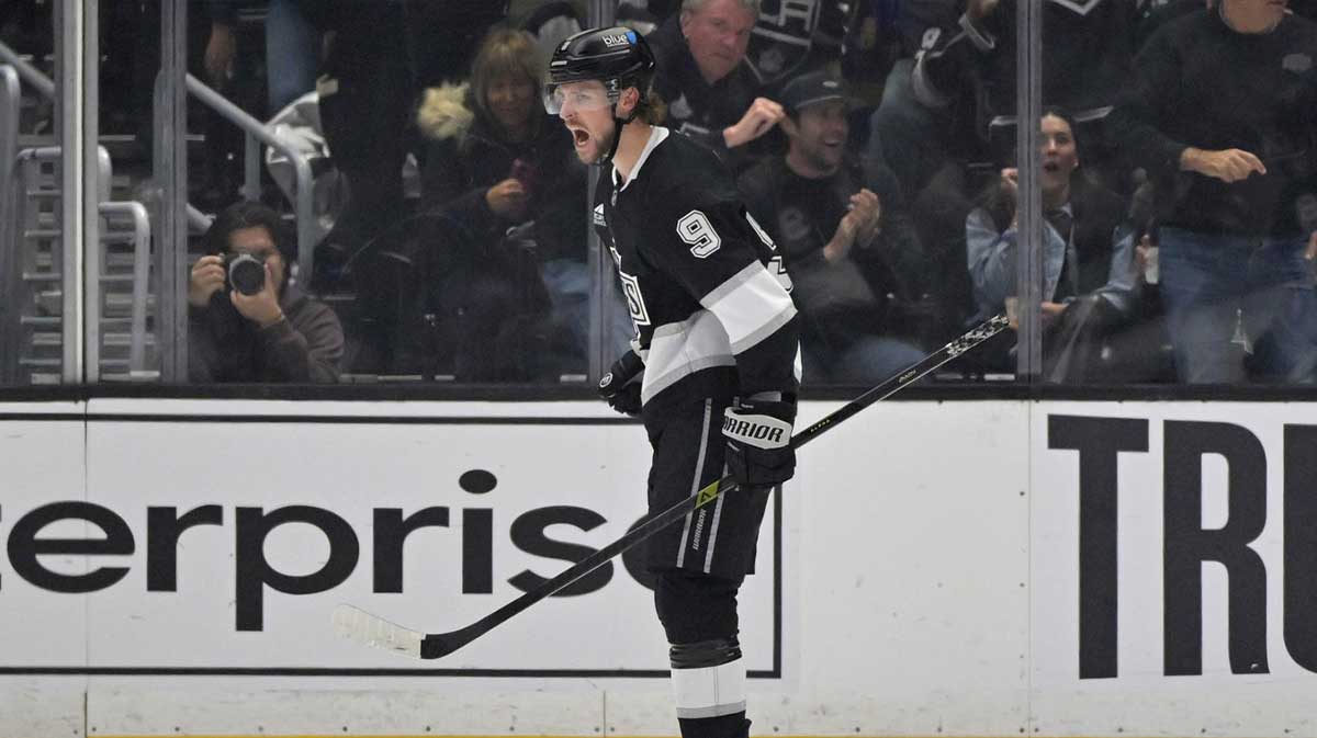 Los Angeles Kings right wing Adrian Kempe (9) celebrates after scoring a goal in the first period against the San Jose Sharks at Crypto.com Arena.