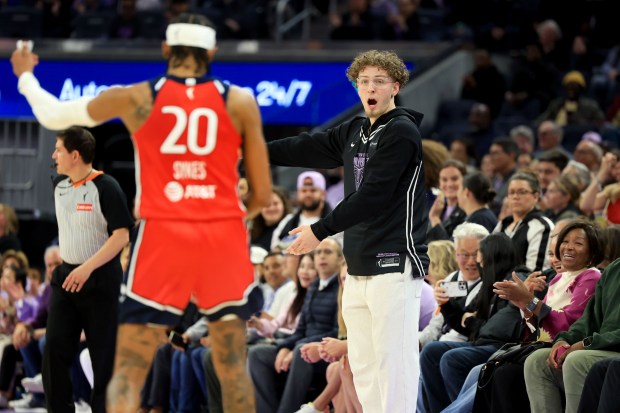 Golden State Warriors' Brandin Podziemski exchanges words with Washington Mystics' Brittney Sykes (20) during the fourth quarter of a WNBA game at Chase Center in San Francisco, Calif., on Wednesday, May 21, 2025. (Ray Chavez/Bay Area News Group)