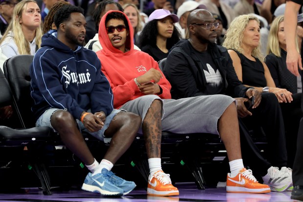 Former Golden State Warriors' Jordan Poole, second from left, attends the Golden State Valkyries game against the Washington Mystics at Chase Center in San Francisco, Calif., on Wednesday, May 21, 2025. (Ray Chavez/Bay Area News Group)