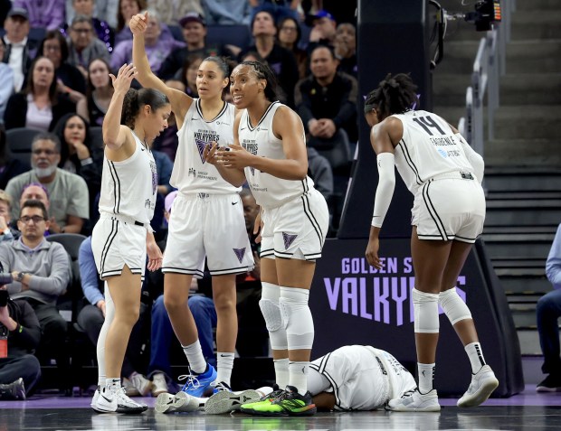 Golden State Valkyries' Tiffany Hayes (15) ends up on the floor in pain after she was fouled by Washington Mystics as her teammtes ask for help in the second quarter of a WNBA game at Chase Center in San Francisco, Calif., on Wednesday, May 21, 2025. (Ray Chavez/Bay Area News Group)