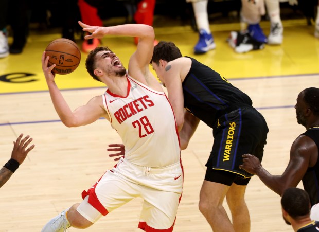 Houston Rockets' Alperen Sengun (28) is fouled by Golden State Warriors' Quinten Post (21) in the 3rd quarter of Game 6 of the Western Conference First Round NBA Playoffs game at Chase Center in San Francisco, Calif., on Friday, May 2, 2025. (Karl Mondon/Bay Area News Group)