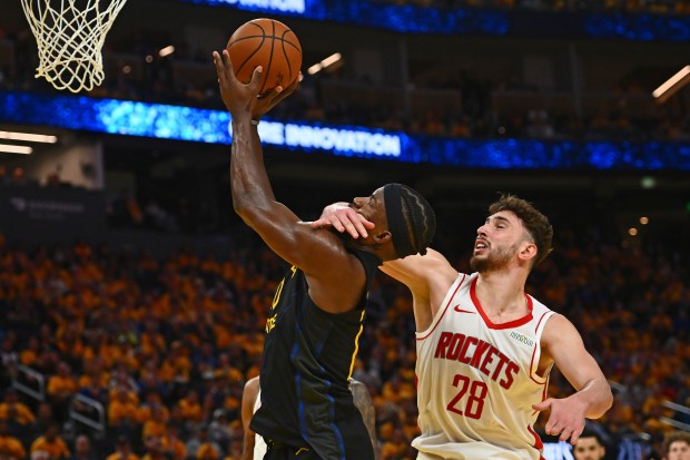 Houston Rockets' Alperen Sengun (28) fouls Golden State Warriors' Jimmy Butler III (10) in the fourth quarter of Game 6 of the Western Conference First Round NBA Playoffs game at Chase Center in San Francisco, Calif., on Friday, May 2, 2025. Sengun would be charged with a flagrant foul on this play. The Houston Rockets defeated the Golden State Warriors 115-107. (Jose Carlos Fajardo/Bay Area News Group)
