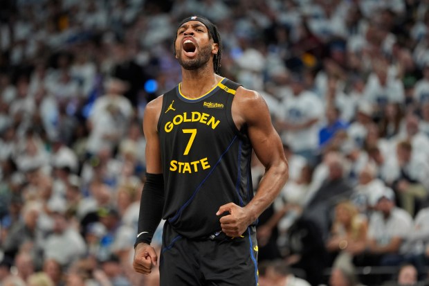 Golden State Warriors guard Buddy Hield (7) celebrates during the second half of Game 1 of an NBA basketball second-round playoff series against the Minnesota Timberwolves, Tuesday, May 6, 2025, in Minneapolis. (AP Photo/Abbie Parr)