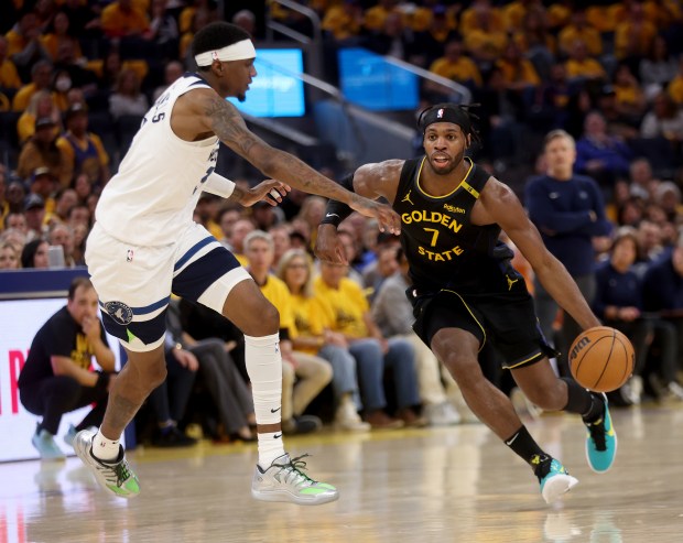 Golden State Warriors' Buddy Hield #7 brings the ball downcourt as he's guarded by Minnesota Timberwolves' Jaden McDaniels #3 in the second quarter of their NBA Western Conference semifinal game at the Chase Center in San Francisco, Calif., on Monday, May 12, 2025. (Jane Tyska/Bay Area News Group)