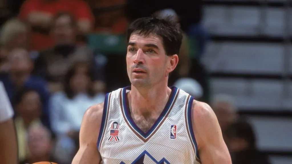 John Stockton #12 of the Utah Jazz dribbles the ball up the court during the game against the Phoenix Suns
