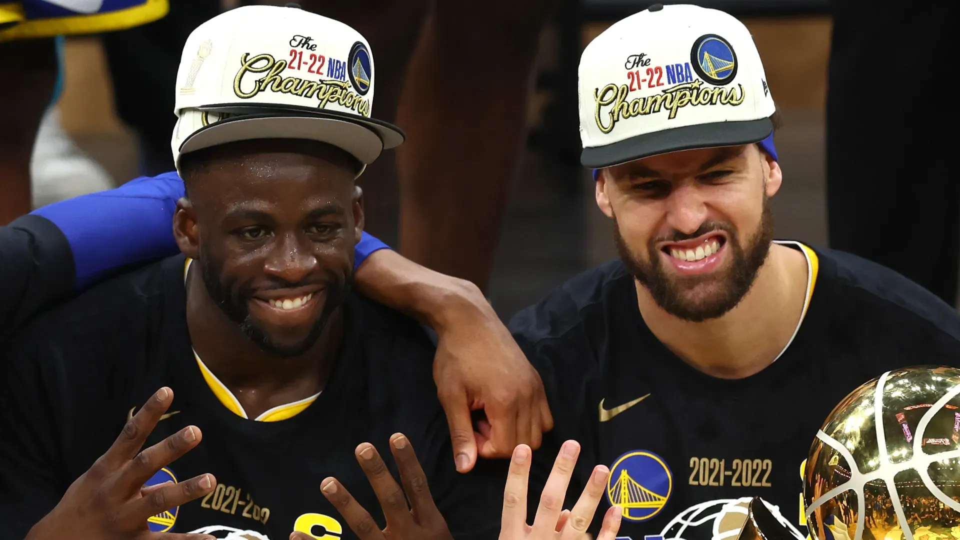 Andre Iguodala #9, Draymond Green #23, Klay Thompson #11 and Stephen Curry #30 of the Golden State Warriors pose for a photo after defeating the Boston Celtics