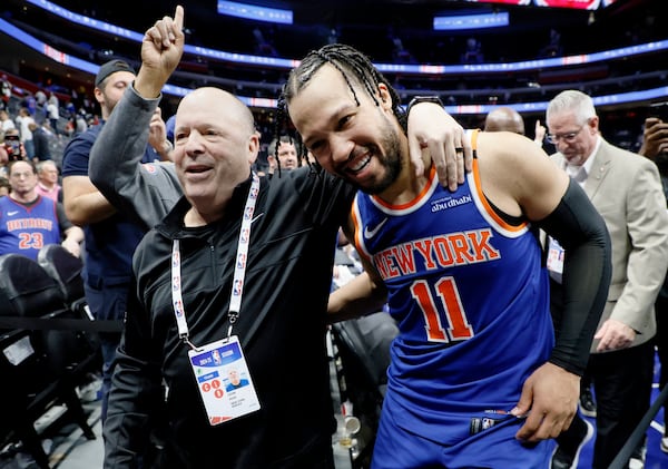 President of the New York Knicks Leon Rose, left, hugs guard Jalen Brunson (11) as they leave the court following a Game 6 win in an NBA basketball first-round playoff series against the Detroit Pistons, Thursday, May 1, 2025, in Detroit. (AP Photo/Duane Burleson)
