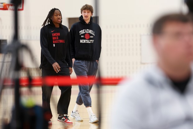Chicago Bulls guard Ayo Dosunmu walks with teammate forward Matas Buzelis during an end-of-season press conference at the Advocate Center on Thursday, April 17, 2025. (Eileen T. Meslar/Chicago Tribune)
