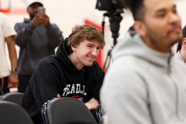 Chicago Bulls forward Matas Buzelis smiles as he listens to teammate guard Ayo Dosunmu speak about him during an end-of-season press conference at the Advocate Center on Thursday, April 17, 2025. (Eileen T. Meslar/Chicago Tribune)