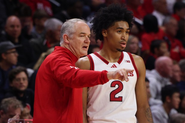 Rutgers coach Steve Pikiell speaks with Dylan Harper during a game against St. John's on Oct. 17, 2024, in Piscataway, N.J. (Ed Mulholland/Getty Images)