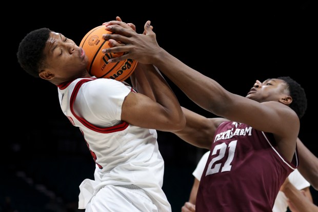 Rutgers' Ace Bailey and Texas A&M's Pharrel Payne battle for a rebound Nov. 30, 2024, in Las Vegas. (AP Photo/Ian Maule)