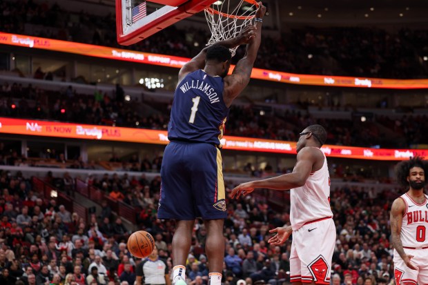 New Orleans Pelicans forward Zion Williamson (1) dunks the ball during the first period against the Chicago Bulls at the United Center Tuesday Jan. 14, 2025, in Chicago. (Armando L. Sanchez/Chicago Tribune)