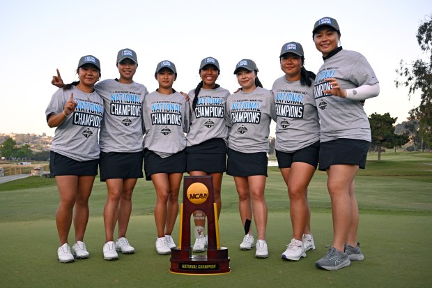 Northwestern University players pose with the winners trophy after the match play finals in the NCAA Division I Women's Golf Championships at Omni La Costa Resort & Spa on May 21, 2025 in Carlsbad, California. (Photo by Orlando Ramirez/Getty Images)